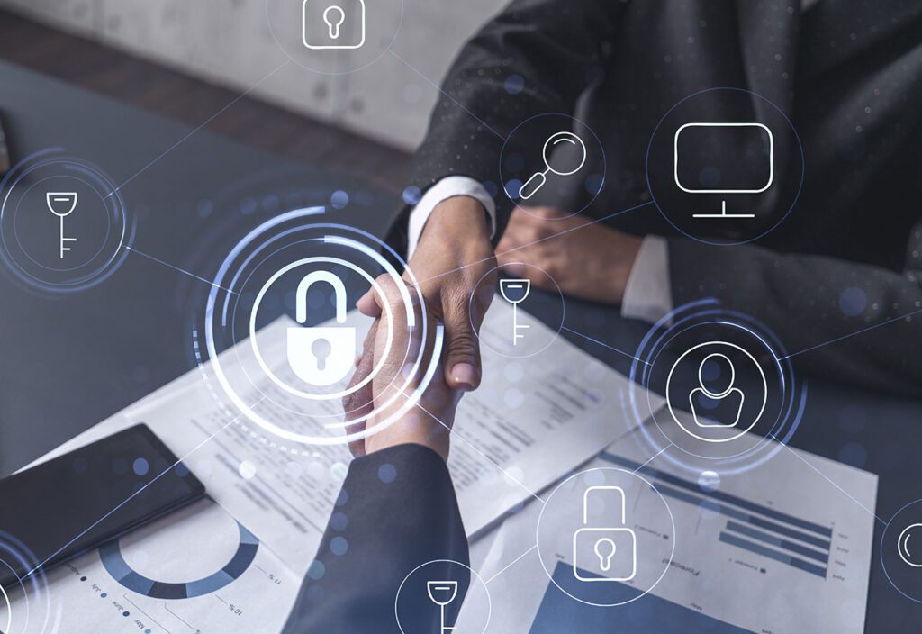 Handshake of two business people entering into contract to protect cyber security of company