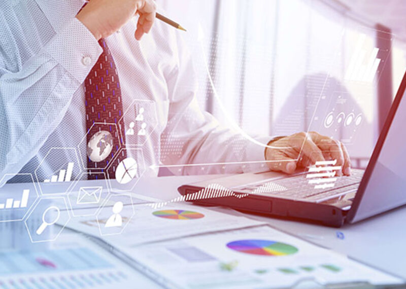 Man holding pencil and analyzing marketing investment data