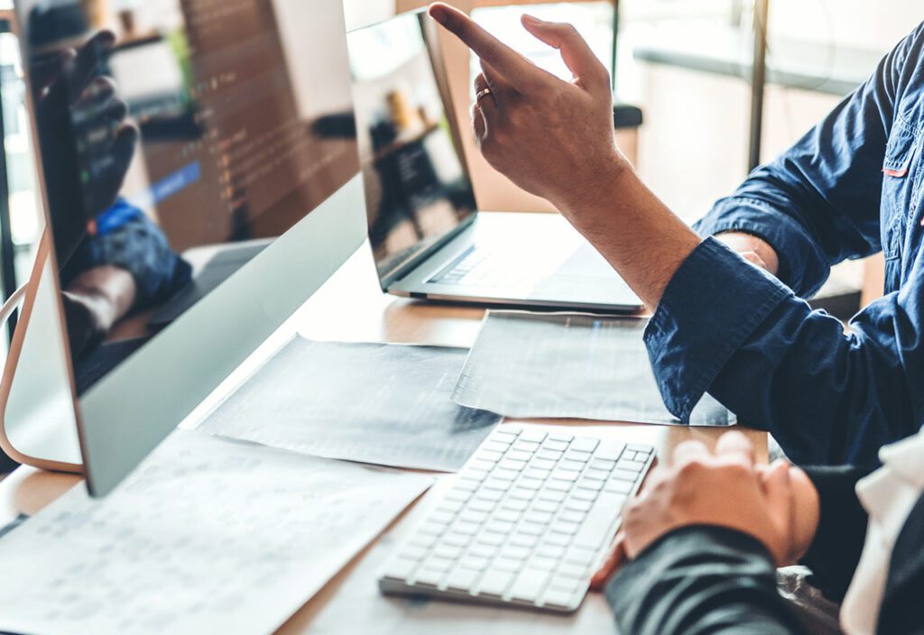 Team Developing Website design and coding technologies working in software company office