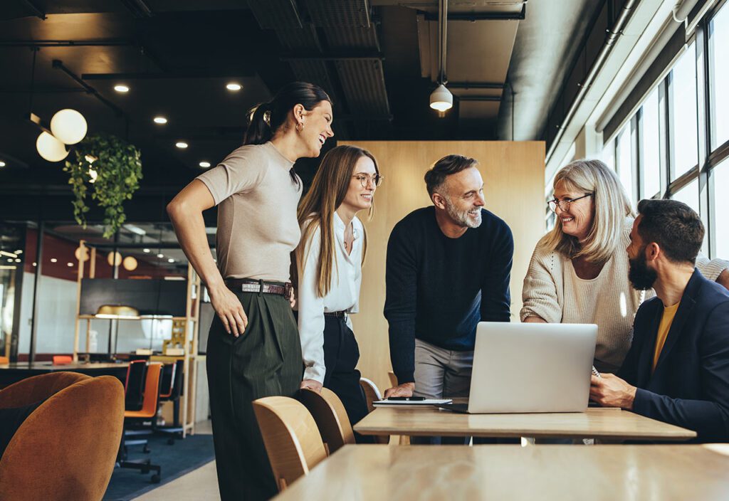 Smiling businesspeople having a discussion in an office