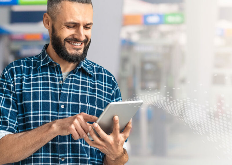 Man using tablet to optimize fuel prices