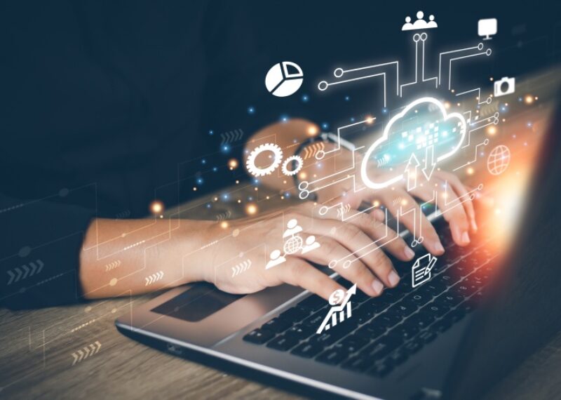 A person typing on a laptop