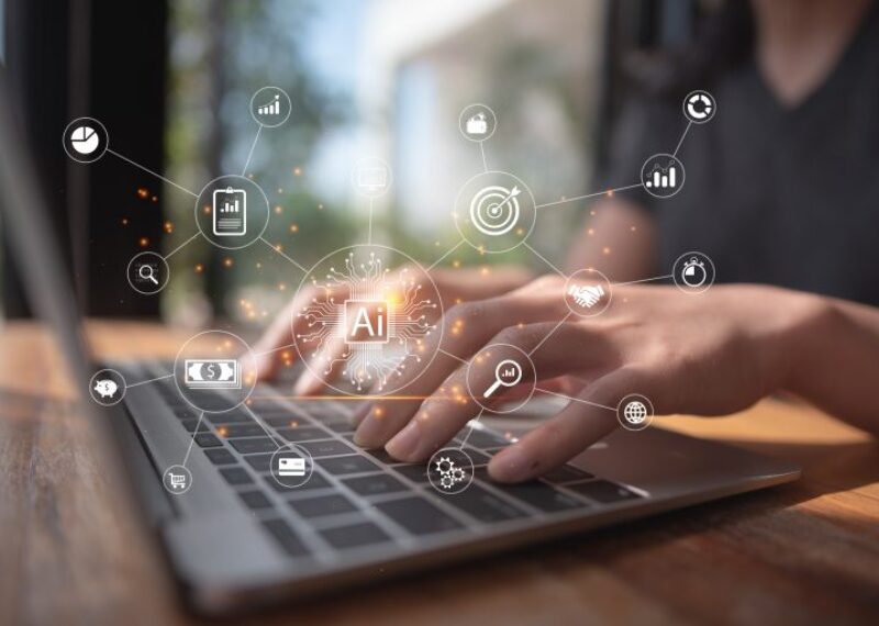 A person typing on a laptop