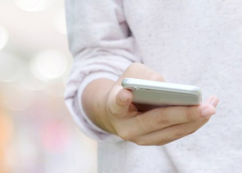 A person holding a cell phone