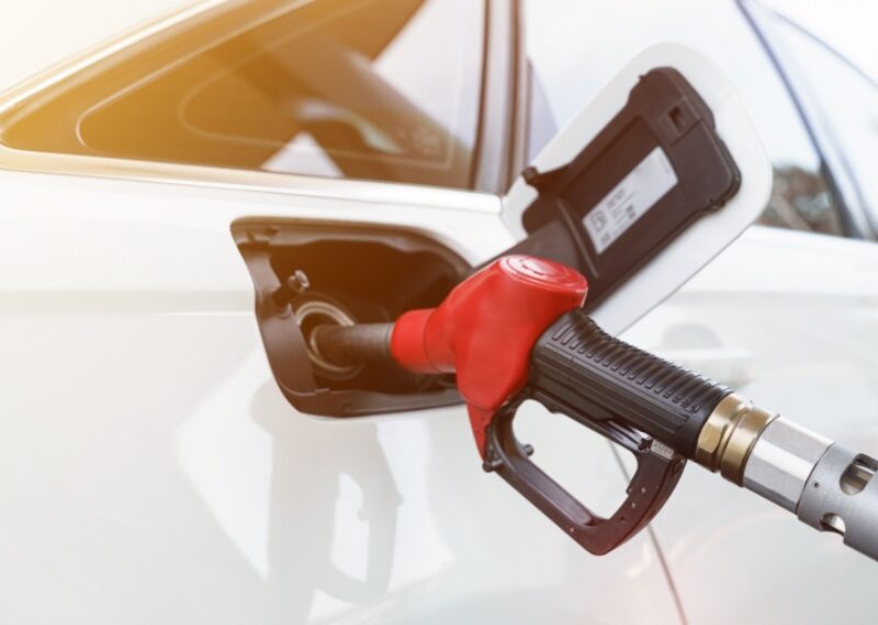 A gas pump nozzle inserted in the fuel tank of a vehicle