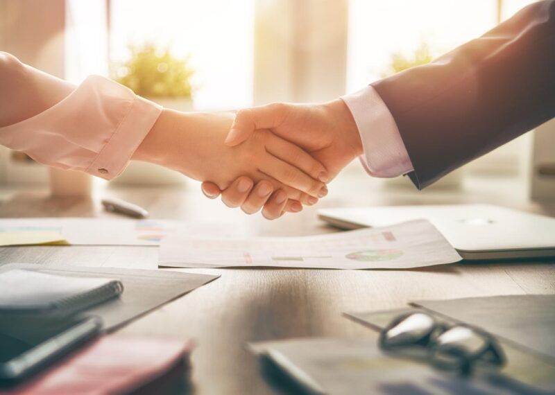 man and woman shaking hands