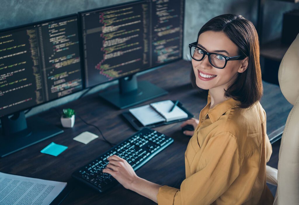 Profile side view portrait of woman developing website cyber security at workplace workstation indoors 