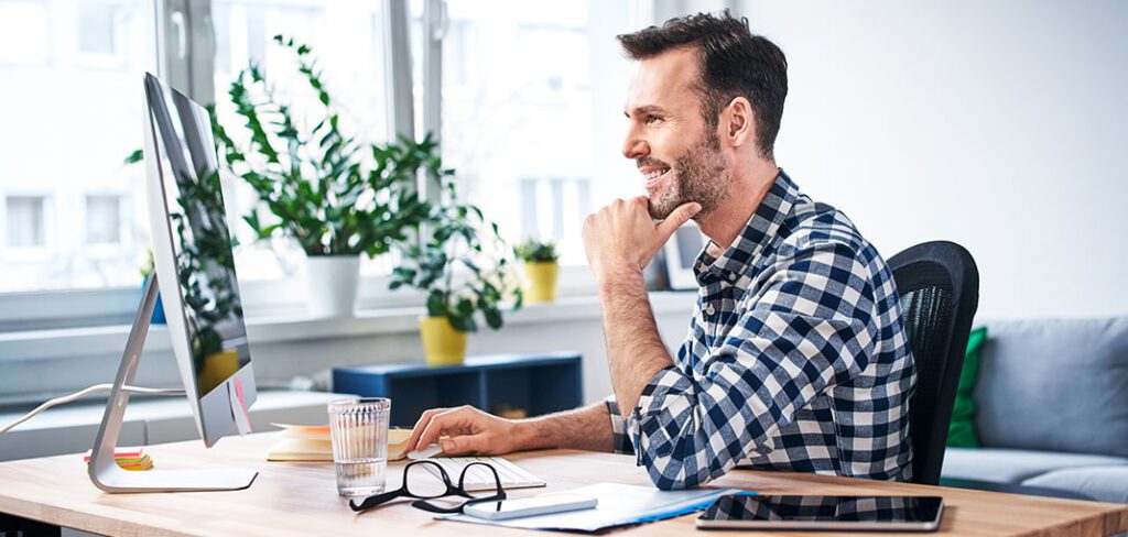 Successful freelancer working on computer while staying at home