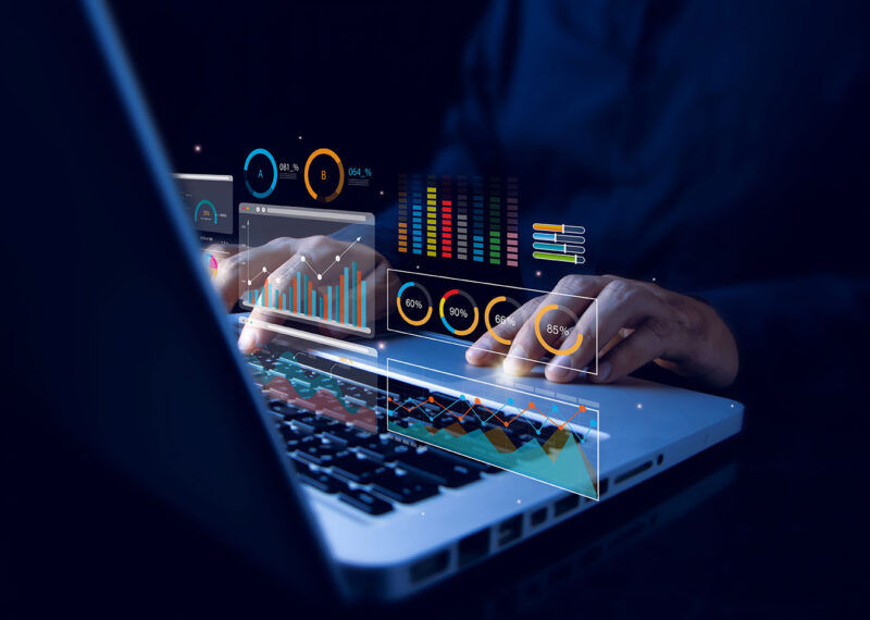 Analyst working with computer in AI-enabled business and accounting analytics and data management