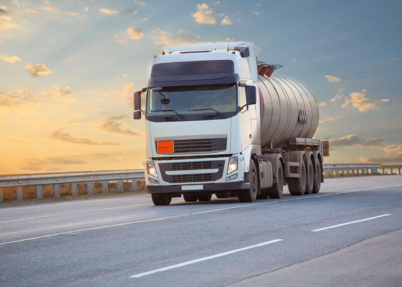 Tanker truck moving on asphalt road
