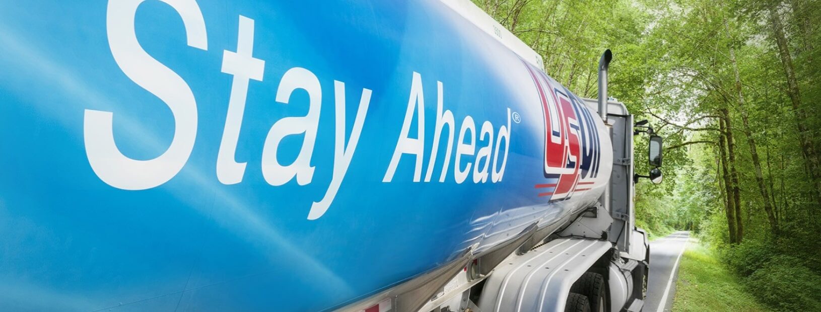 US Oil fuel tanker truck driving down country road