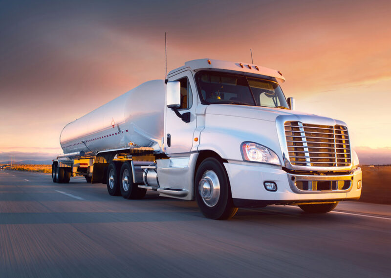 Fuel truck moving on asphalt road