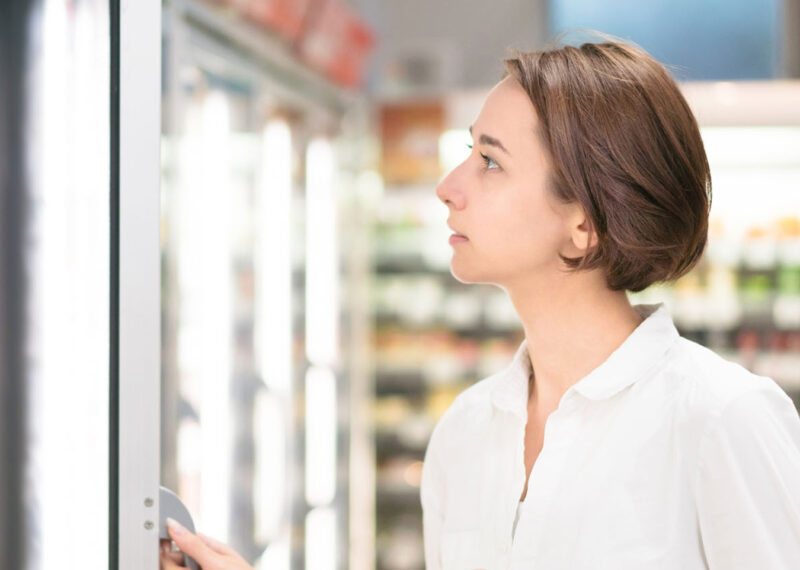 Female customer shopping for CPG in c-store