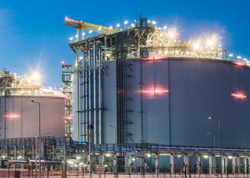 Oil refinery lit up at night.