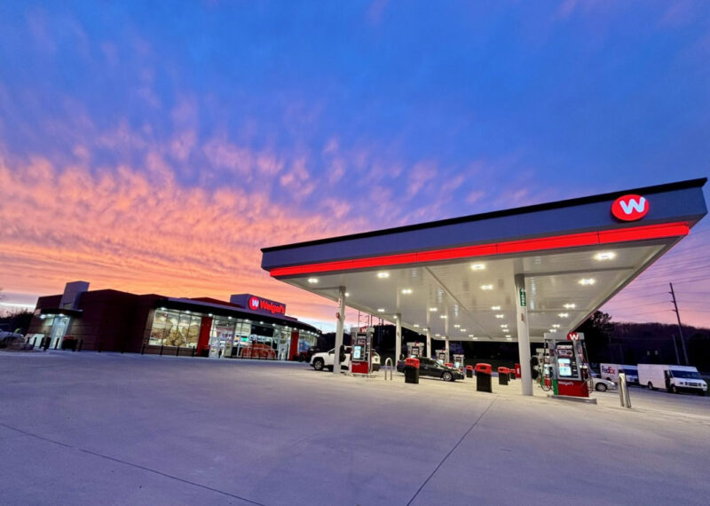 Weigel’s modern convenience store and gas station at sunset, symbolizing personalized retail experiences made possible by PDI Experience Designer